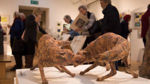 Sculpture of two brown foxes at Art exhibition