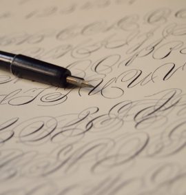 pen on paper with calligraphy writing
