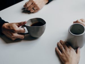 Two people having coffee together