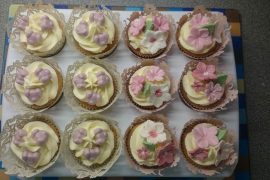 Cupcakes decorated with pink flowers
