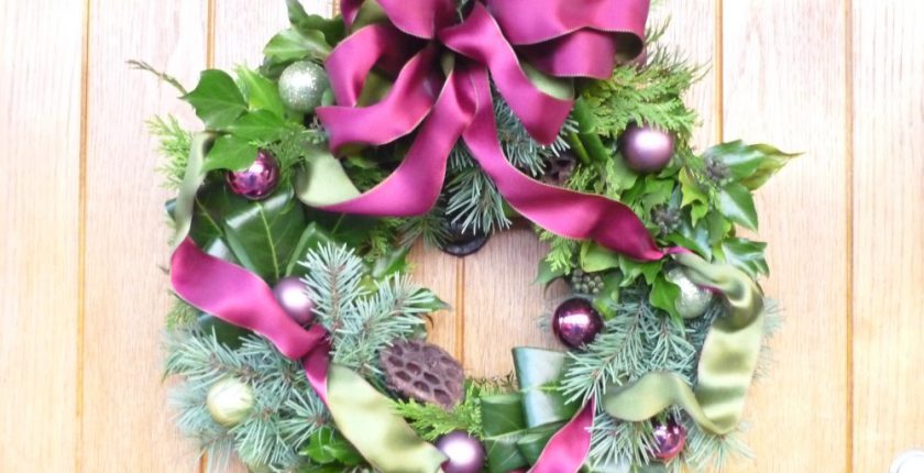 Purple and green christmas wreath with baubles