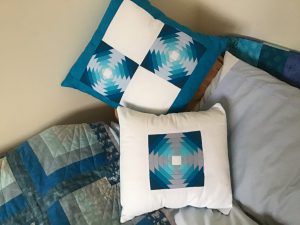 Blue and cream patchwork cushions