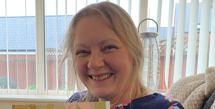 Author holding her book