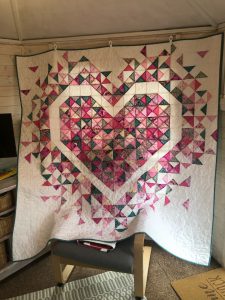 Patchwork quilt with heart design