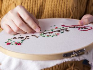 Woman stitching embroidery