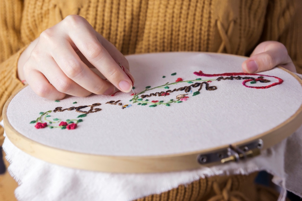 Woman stitching embroidery
