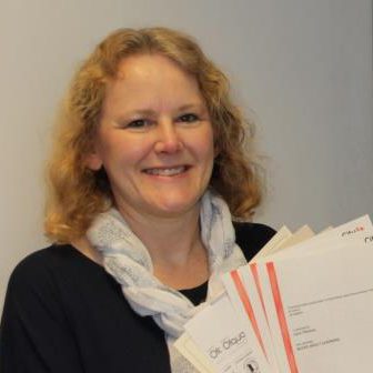 Lady with blond hair and scarf holding certificates