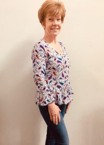 Woman in handmade paisley blouse