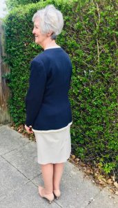 Woman in handmade skirt and jacket - back view