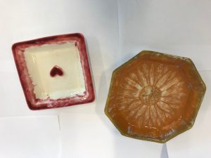 Two handmade decorated ceramic dishes
