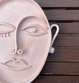 Ceramic handmade platter in shape of a face in style of Picasso