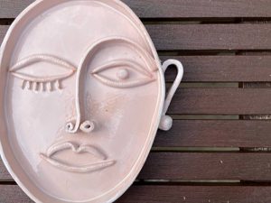 Ceramic handmade platter in shape of a face in style of Picasso