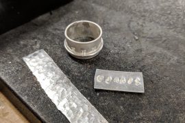 Silver ring and metal strips