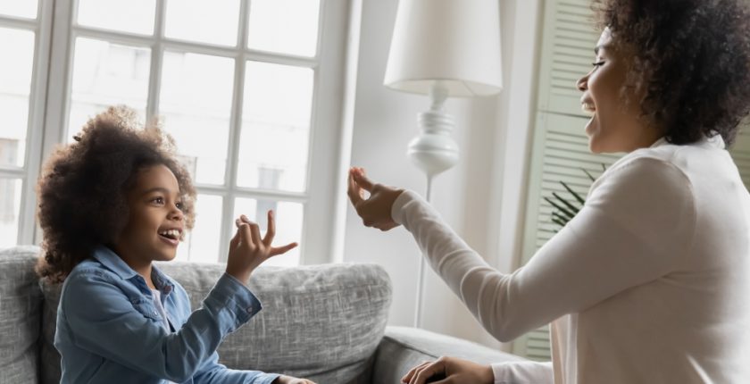 Mother and child using sign language