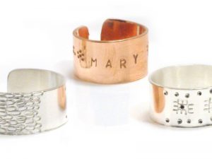 One copper ring and two silver rings