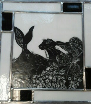 Stained glass panel with rabbits