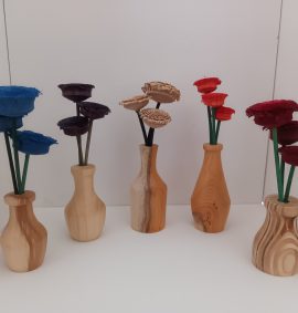 A row of 5 wooden vases