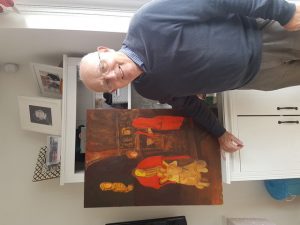 Man standing with his painting