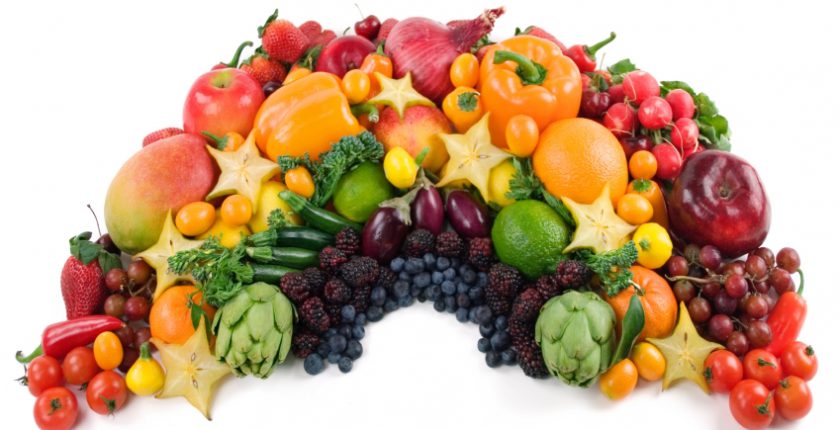 Fruit and vegetables laid out in rainbow shape